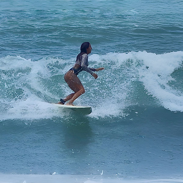 Woman on surfing board in Pavones